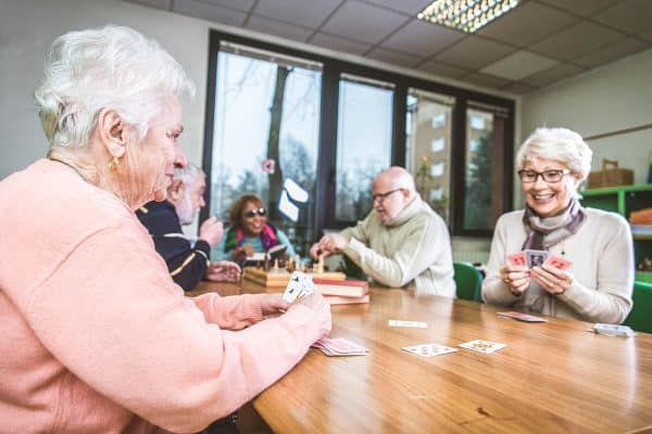 Elderly Friends Playing Cards at Agrigate site.